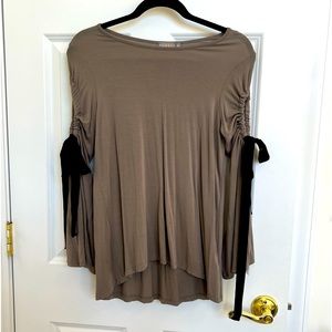 This cute and comfy top can be dressed up or down with jeans or leggings.